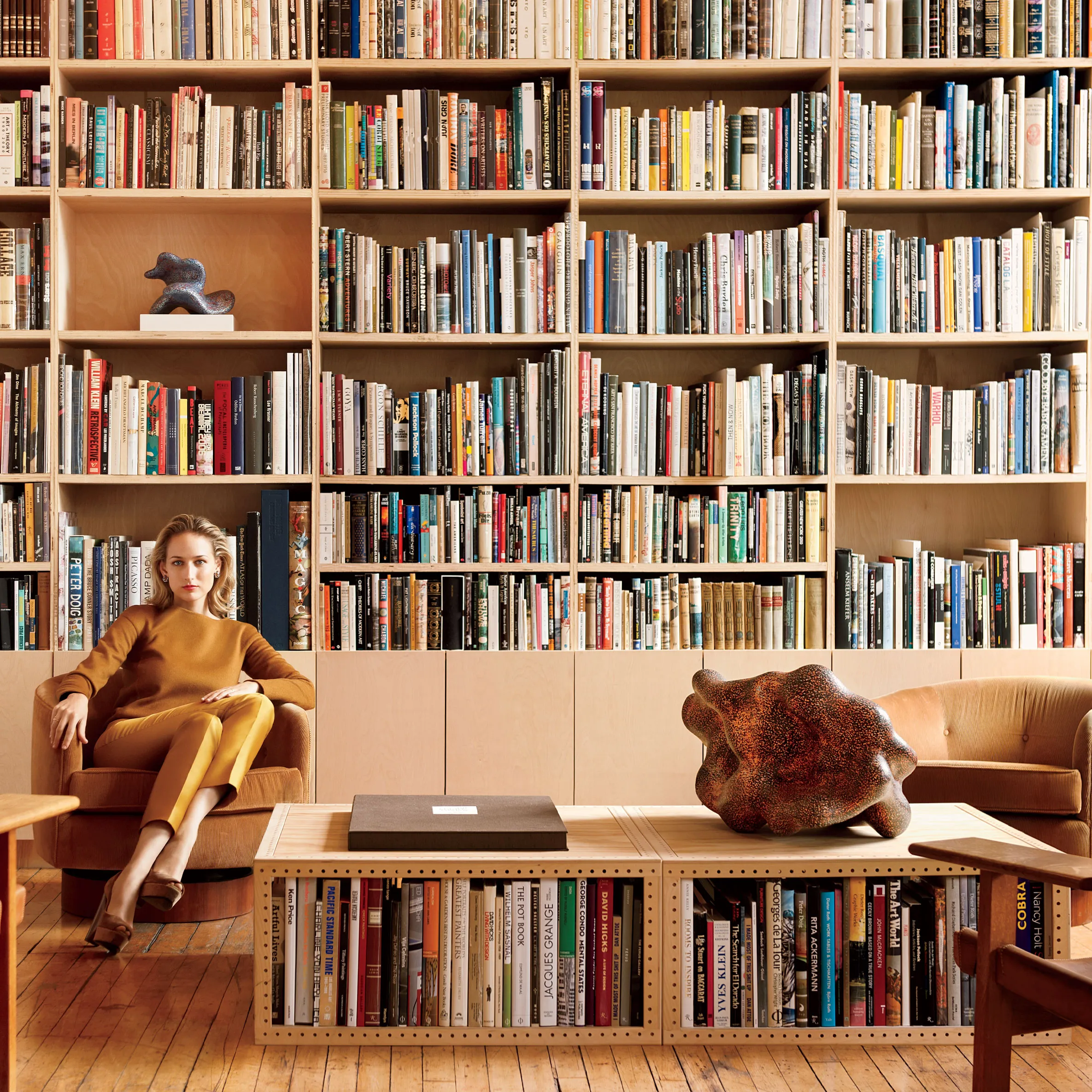 Bookshelves and coffee bags displayed together in a warm setting